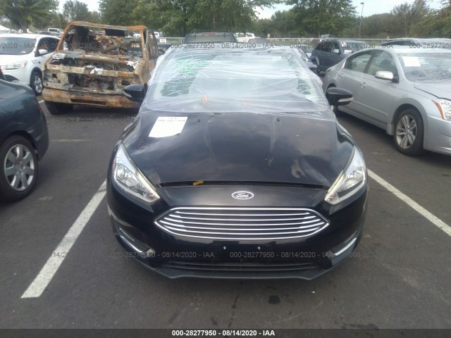 Photo 5 VIN: 1FADP3N25GL330062 - FORD FOCUS 