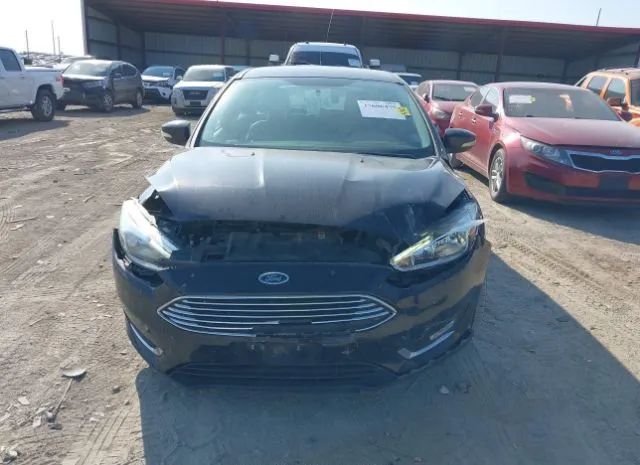 Photo 5 VIN: 1FADP3N27GL345999 - FORD FOCUS 