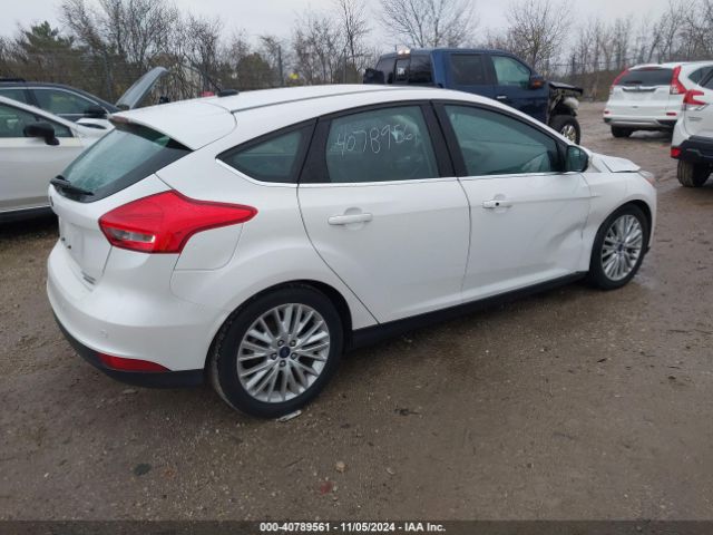 Photo 3 VIN: 1FADP3N28GL242879 - FORD FOCUS 