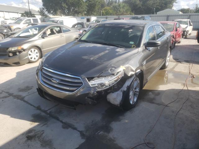 Photo 1 VIN: 1FAHP2D80GG145301 - FORD TAURUS SE 