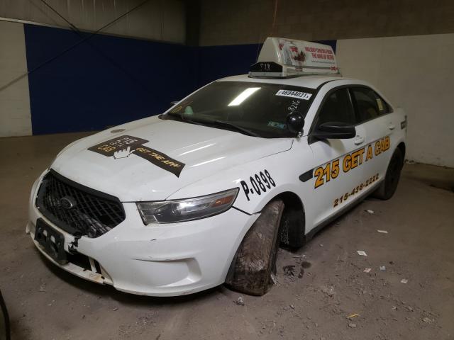 Photo 1 VIN: 1FAHP2L89EG138216 - FORD TAURUS POL 