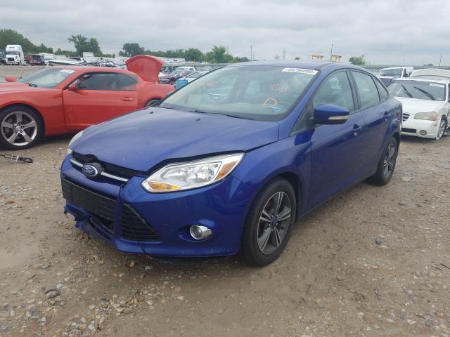 Photo 1 VIN: 1FAHP3F20CL329282 - FORD FOCUS SE 