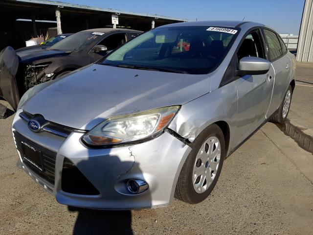 Photo 1 VIN: 1FAHP3F24CL295010 - FORD FOCUS SE 