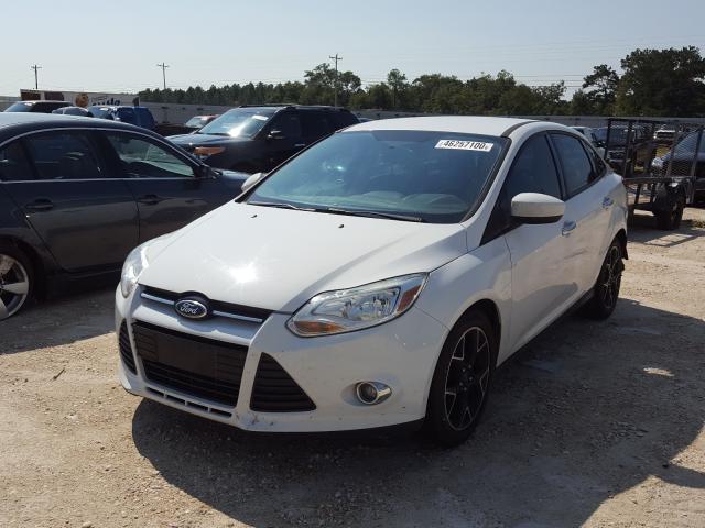 Photo 1 VIN: 1FAHP3F24CL323159 - FORD FOCUS SE 