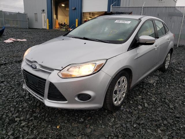 Photo 1 VIN: 1FAHP3F24CL388724 - FORD FOCUS SE 