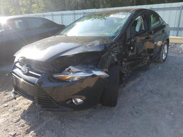 Photo 1 VIN: 1FAHP3F24CL402086 - FORD FOCUS SE 