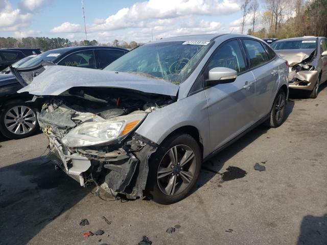 Photo 1 VIN: 1FAHP3F26CL321171 - FORD FOCUS SE 