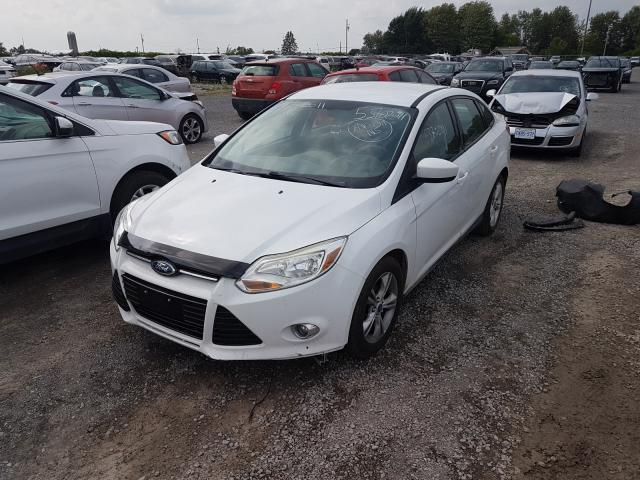 Photo 1 VIN: 1FAHP3F27CL112585 - FORD FOCUS SE 