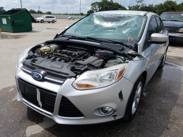 Photo 1 VIN: 1FAHP3F27CL277004 - FORD FOCUS SE 