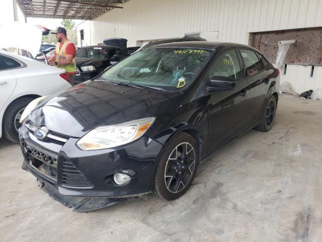 Photo 1 VIN: 1FAHP3F27CL381024 - FORD FOCUS SE 