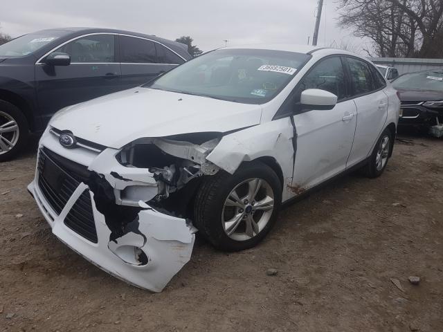 Photo 1 VIN: 1FAHP3F29CL232291 - FORD FOCUS SE 