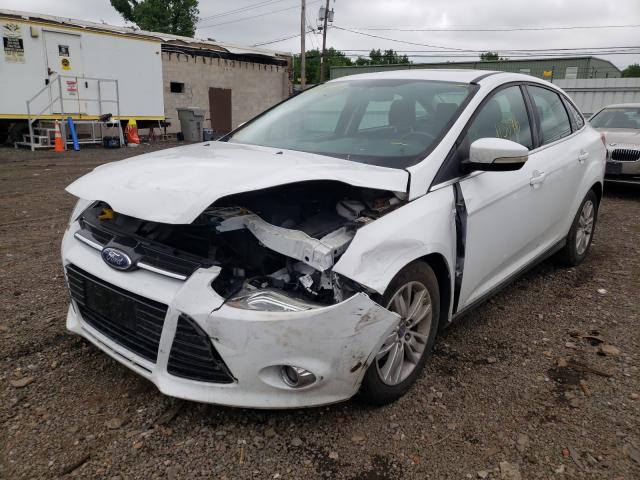 Photo 1 VIN: 1FAHP3H21CL229043 - FORD FOCUS SEL 