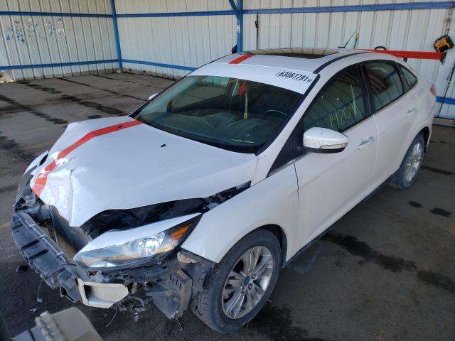 Photo 1 VIN: 1FAHP3H23CL403033 - FORD FOCUS SEL 