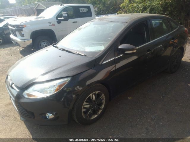 Photo 1 VIN: 1FAHP3H26CL457880 - FORD FOCUS 