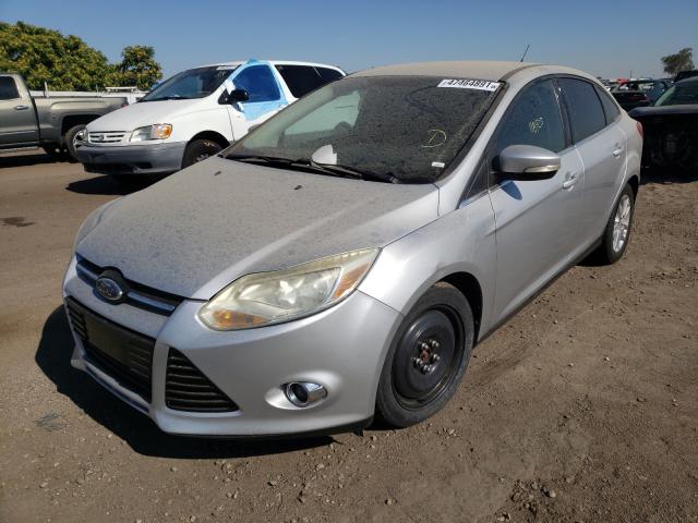 Photo 1 VIN: 1FAHP3H28CL417011 - FORD FOCUS SEL 