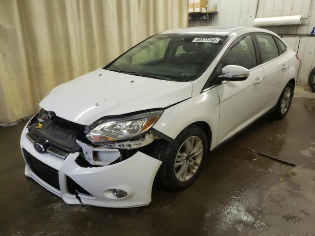 Photo 1 VIN: 1FAHP3H29CL349754 - FORD FOCUS SEL 