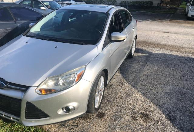 Photo 1 VIN: 1FAHP3H2XCL324989 - FORD FOCUS SEL 