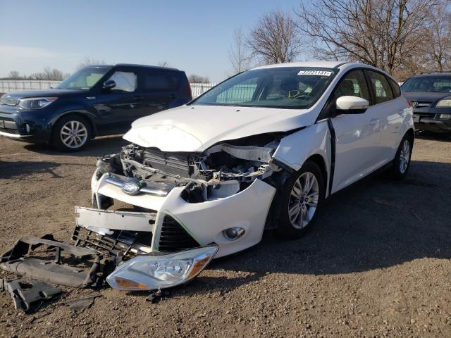 Photo 1 VIN: 1FAHP3M24CL228703 - FORD FOCUS SEL 