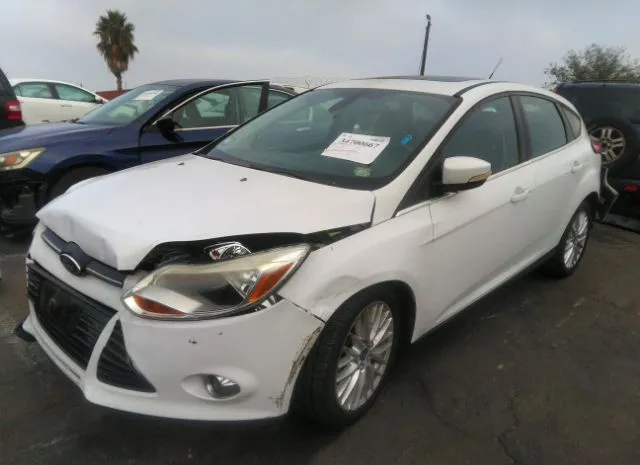 Photo 1 VIN: 1FAHP3M24CL477373 - FORD FOCUS 