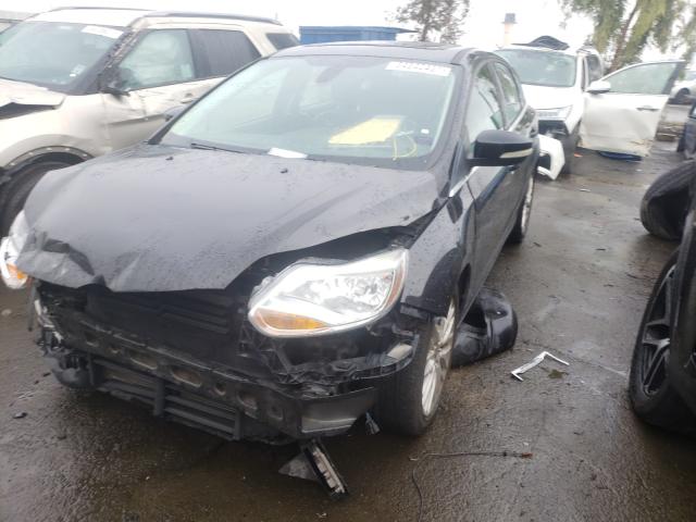 Photo 1 VIN: 1FAHP3M28CL371475 - FORD FOCUS SEL 