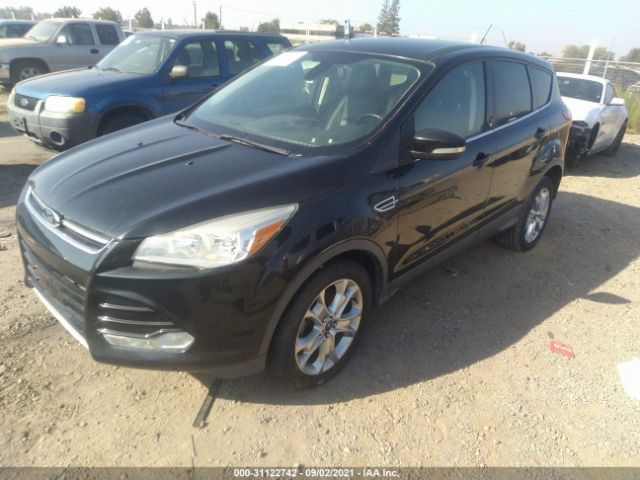 Photo 1 VIN: 1FMCU0HX0DUB41020 - FORD ESCAPE 