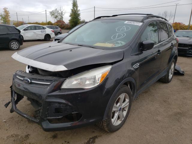 Photo 1 VIN: 1FMCU9GX0EUD11772 - FORD ESCAPE SE 