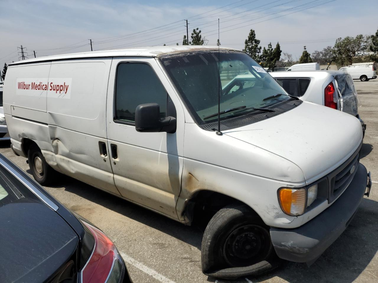 Photo 3 VIN: 1FTRE14203HA11869 - FORD ECONOLINE 