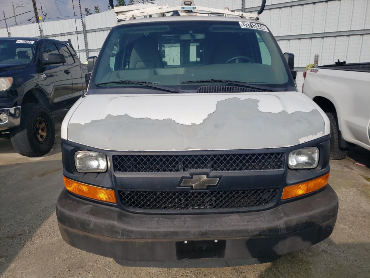 Photo 4 VIN: 1GCWGFCB5C1122406 - CHEVROLET EXPRESS 