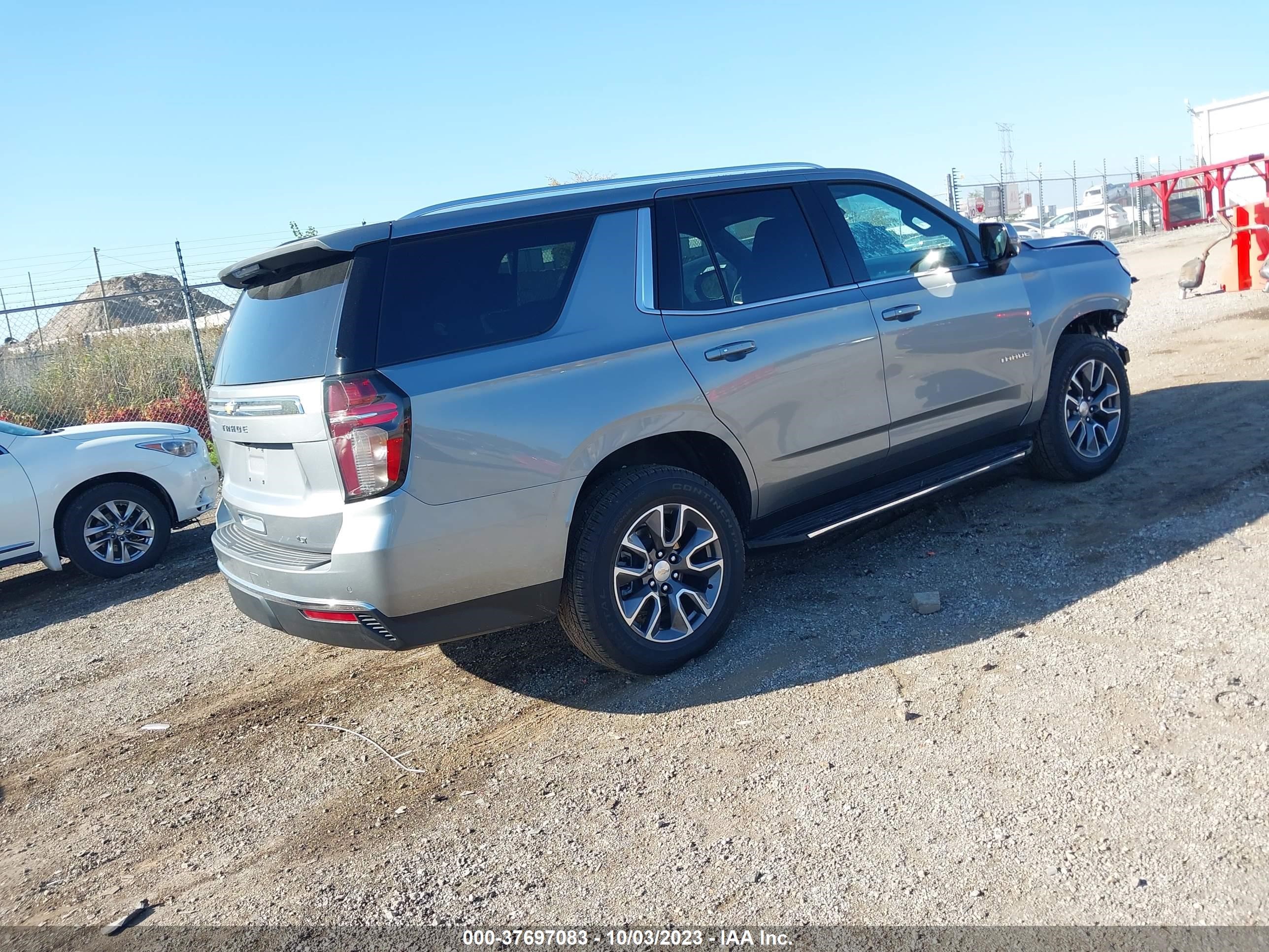 Photo 3 VIN: 1GNSKNKD3PR242634 - CHEVROLET TAHOE 