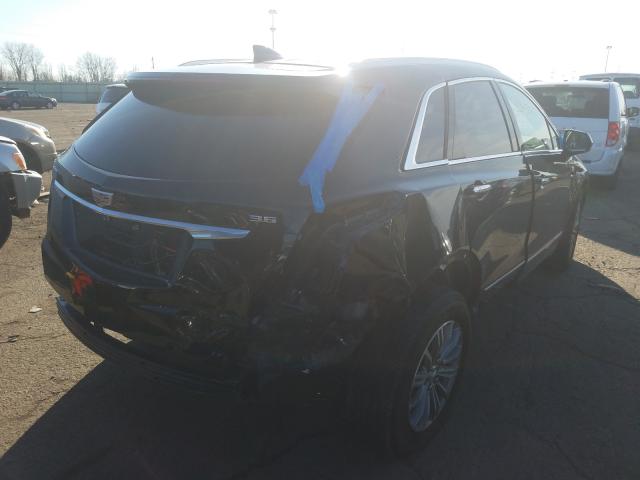 Photo 3 VIN: 1GYKNCRS0KZ140235 - CADILLAC XT5 LUXURY 