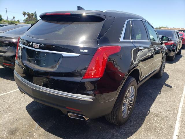 Photo 3 VIN: 1GYKNCRS9KZ211044 - CADILLAC XT5 LUXURY 