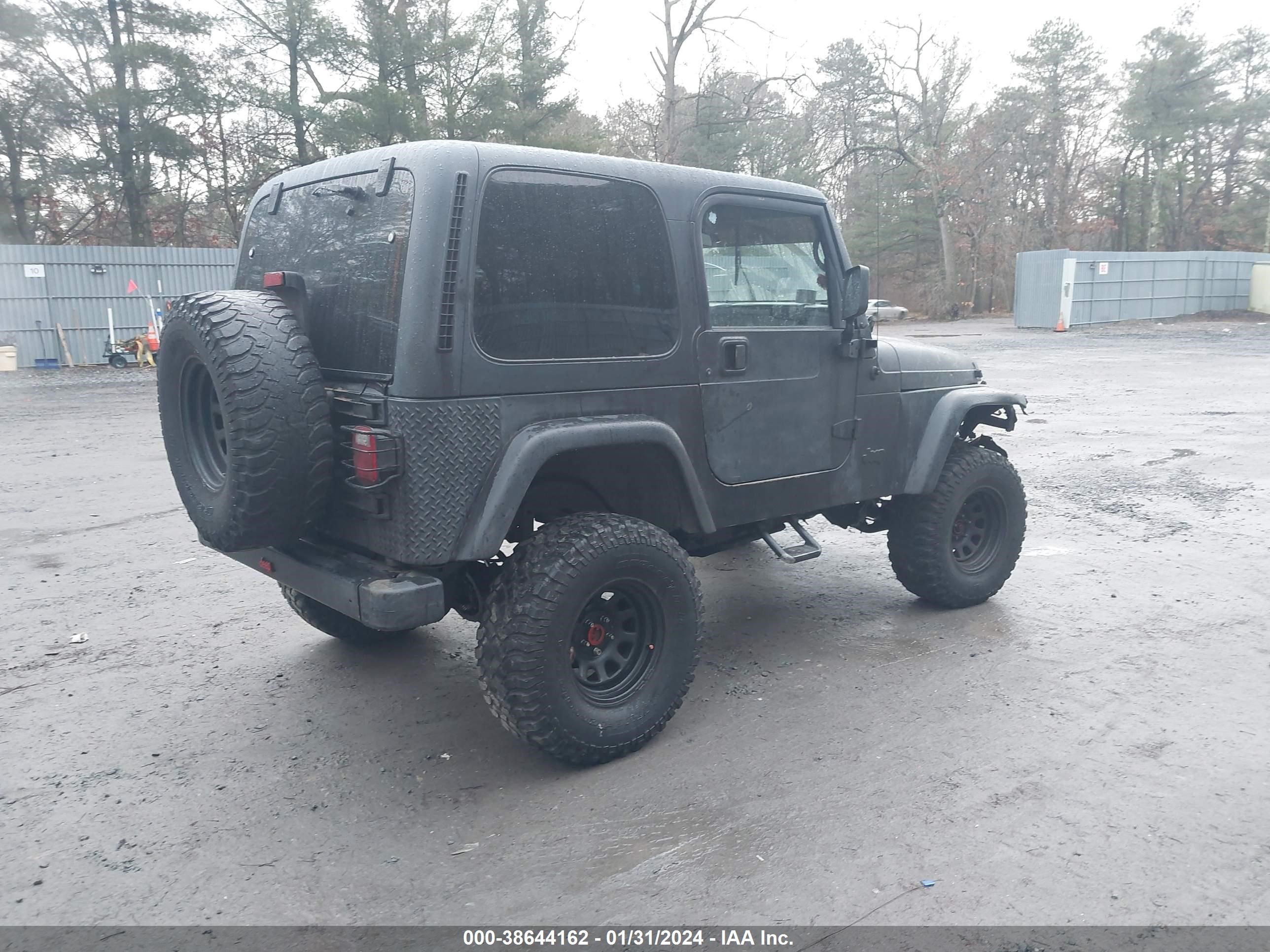 Photo 3 VIN: 1J4FA29P0YP700052 - JEEP WRANGLER 