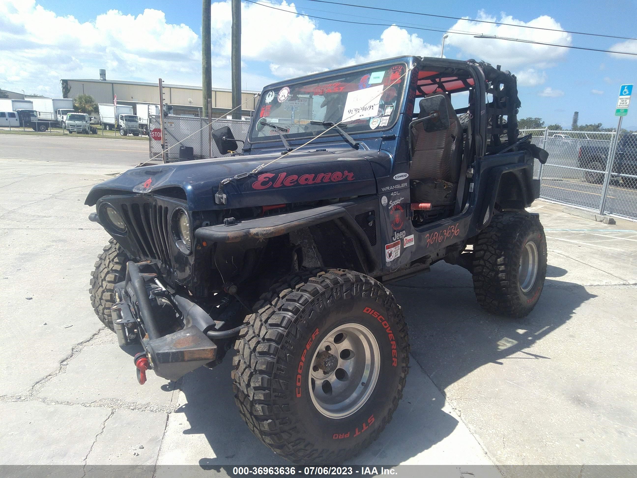 Photo 1 VIN: 1J4FA49S1YP803643 - JEEP WRANGLER 