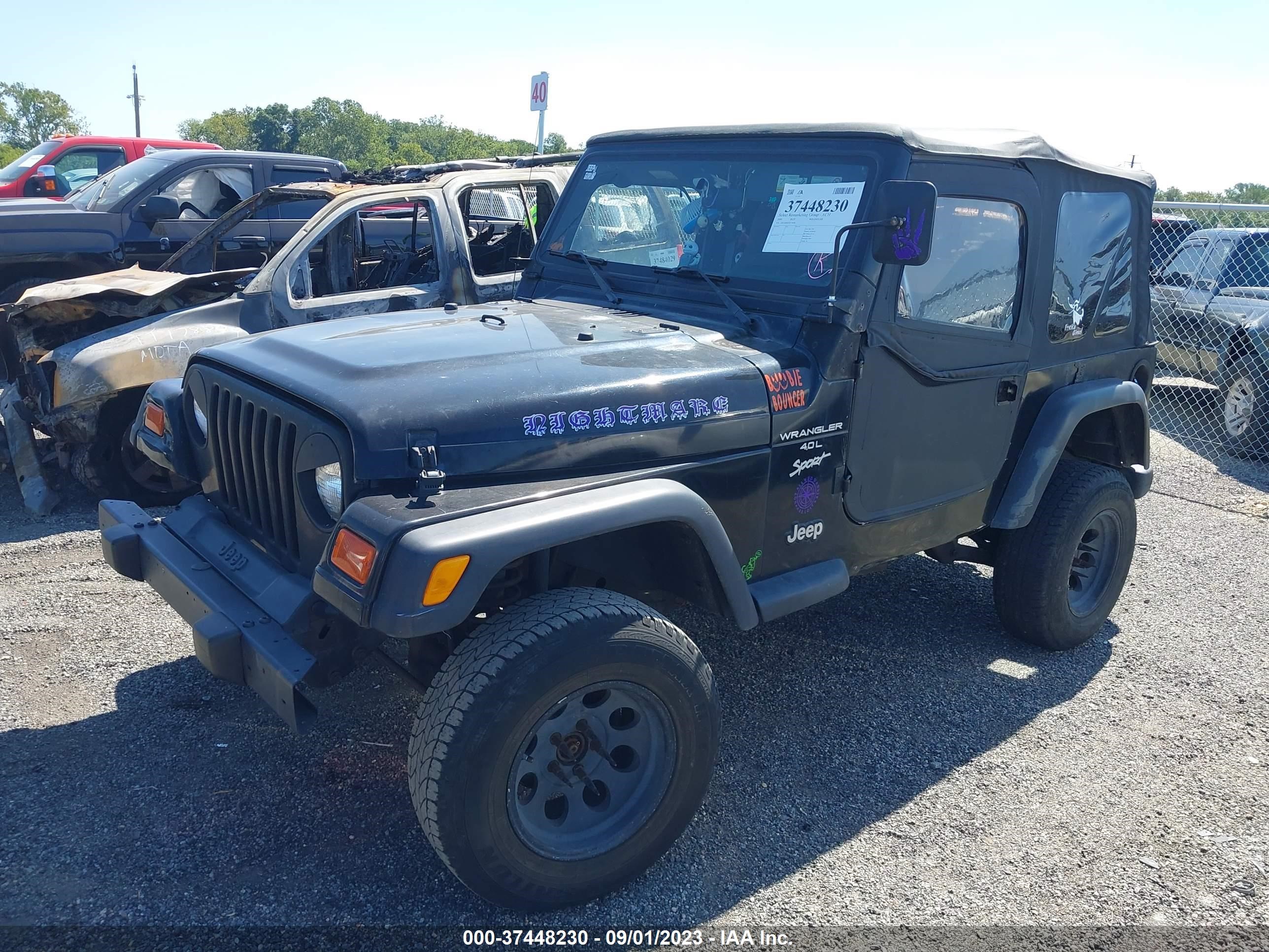 Photo 1 VIN: 1J4FA49S4YP719090 - JEEP WRANGLER 