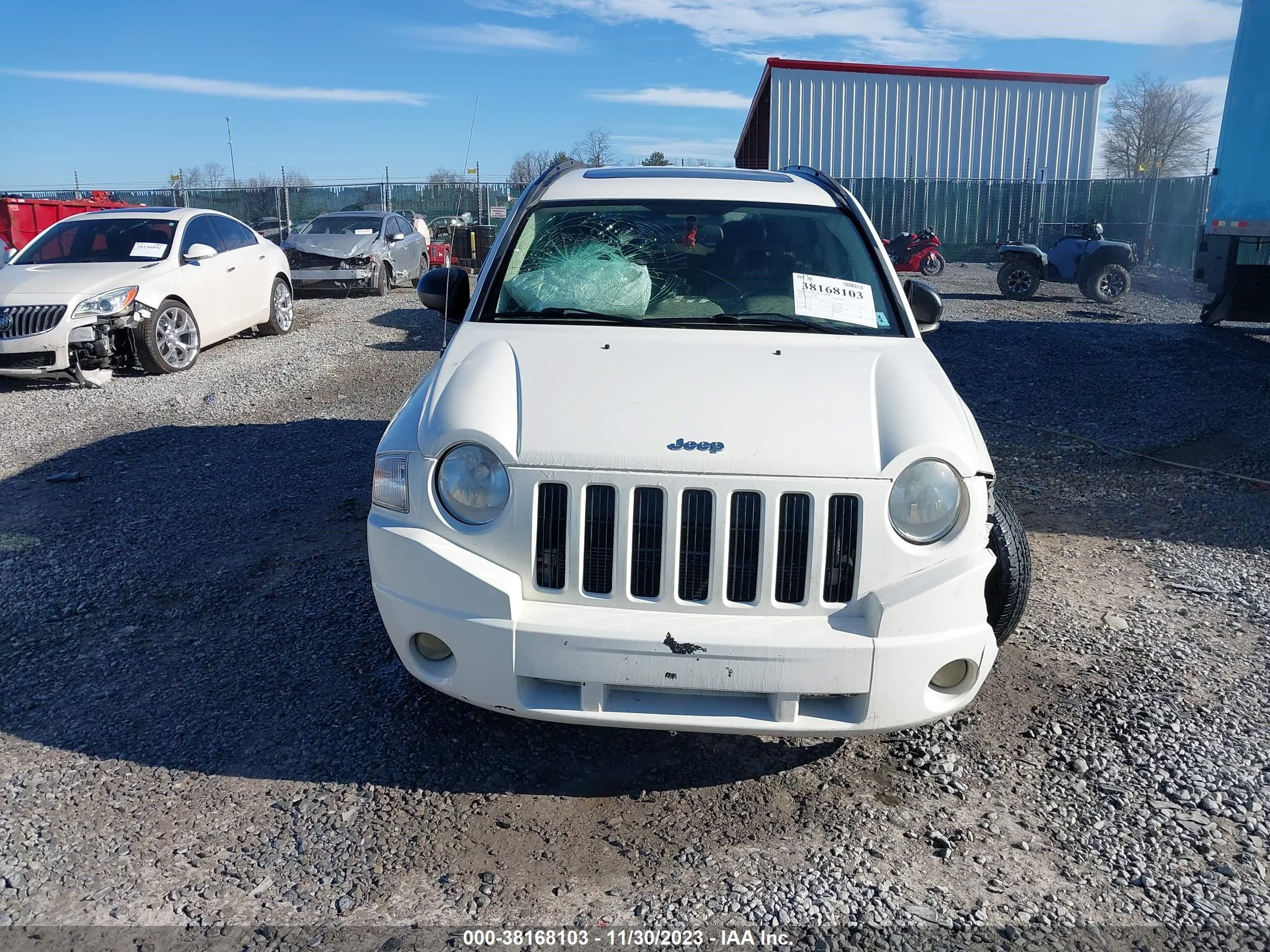 Photo 12 VIN: 1J4FF47B09D120825 - JEEP COMPASS 