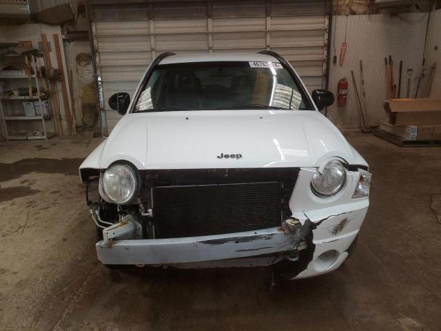 Photo 4 VIN: 1J4FT47A49D128619 - JEEP COMPASS 