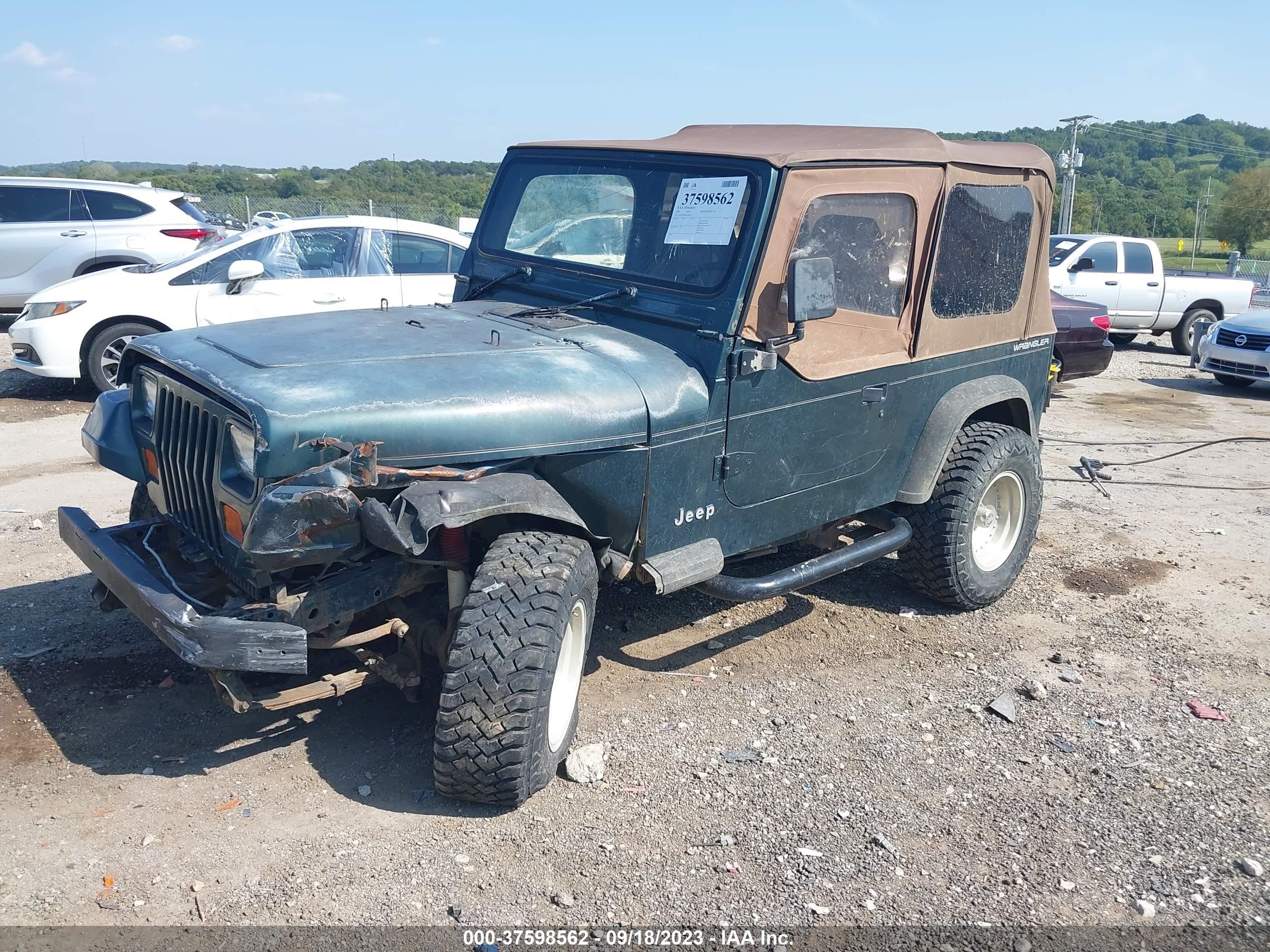 Photo 1 VIN: 1J4FY19PXRP456823 - JEEP WRANGLER 