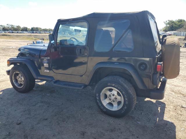 Photo 1 VIN: 1J4FY19S8WP737597 - JEEP WRANGLER 2 