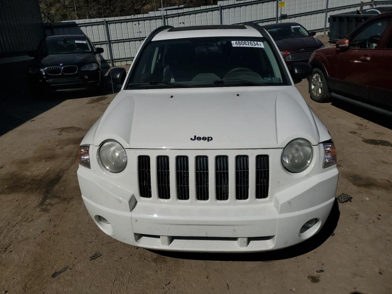 Photo 4 VIN: 1J4NF4FB4AD593340 - JEEP COMPASS 