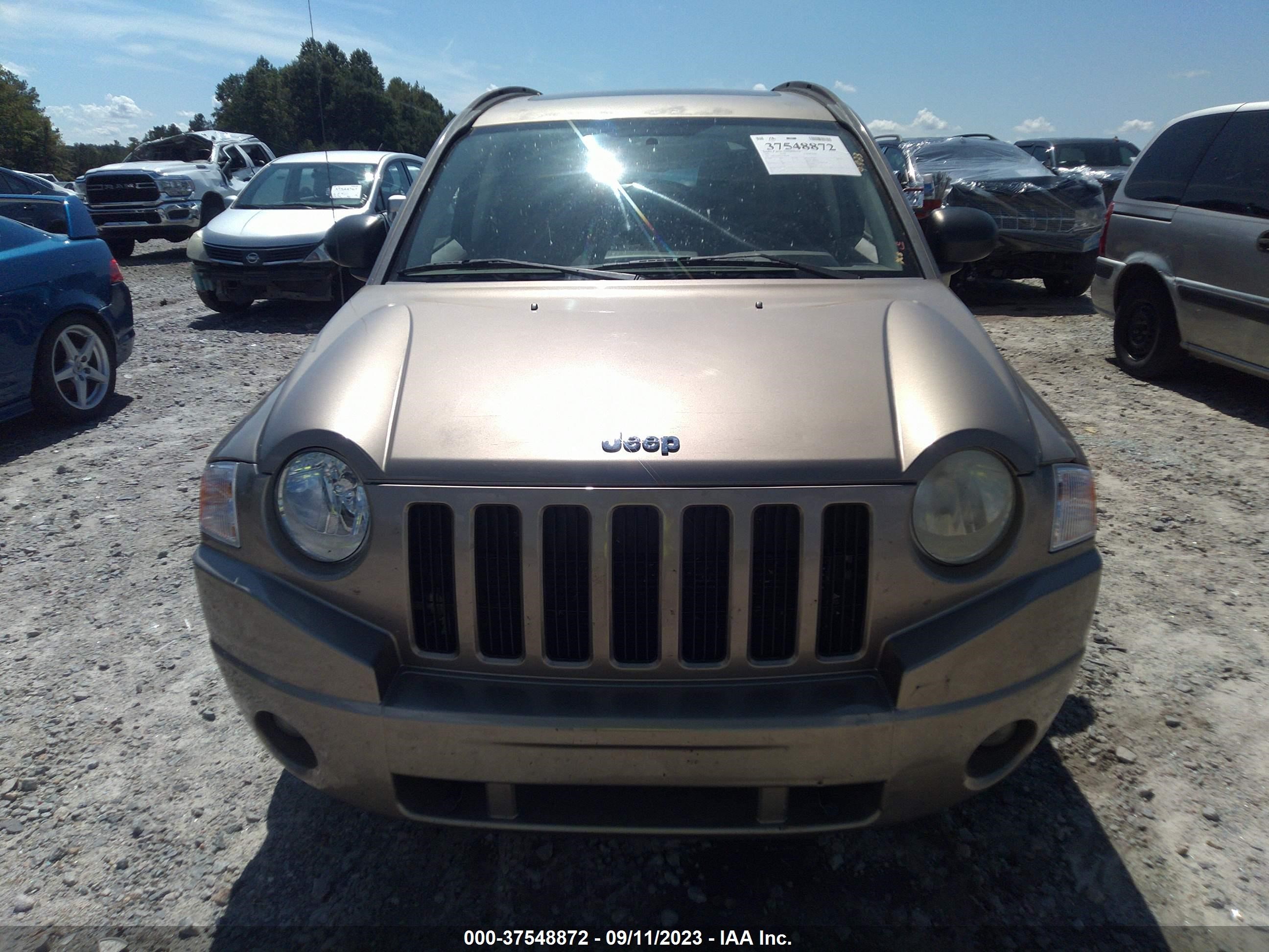 Photo 11 VIN: 1J8FT47W77D189938 - JEEP COMPASS 