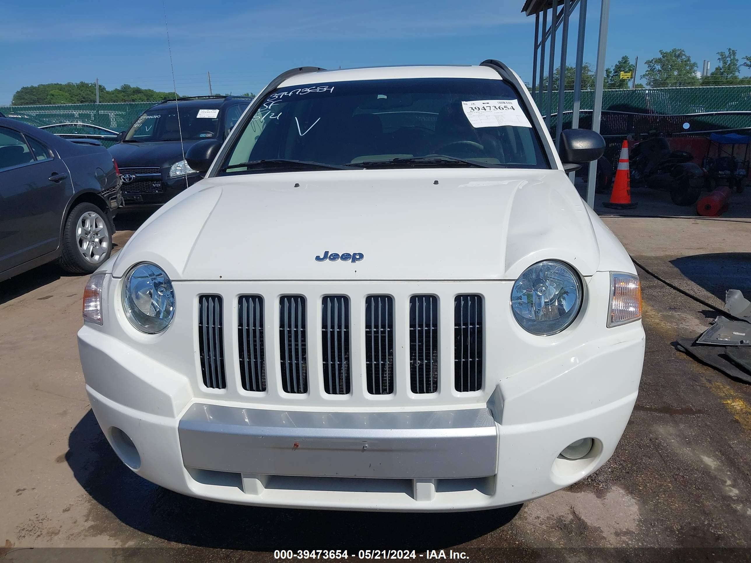 Photo 11 VIN: 1J8FT57W88D663919 - JEEP COMPASS 