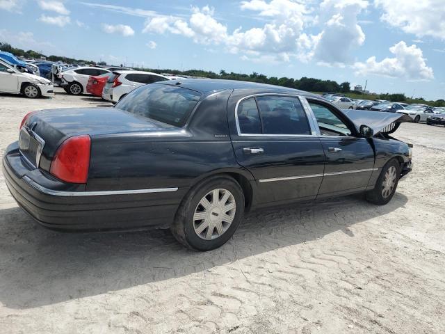 Photo 2 VIN: 1LNHM84W94Y668855 - LINCOLN TOWN CAR E 