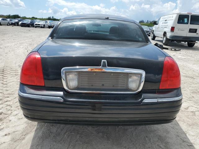 Photo 5 VIN: 1LNHM84W94Y668855 - LINCOLN TOWN CAR E 