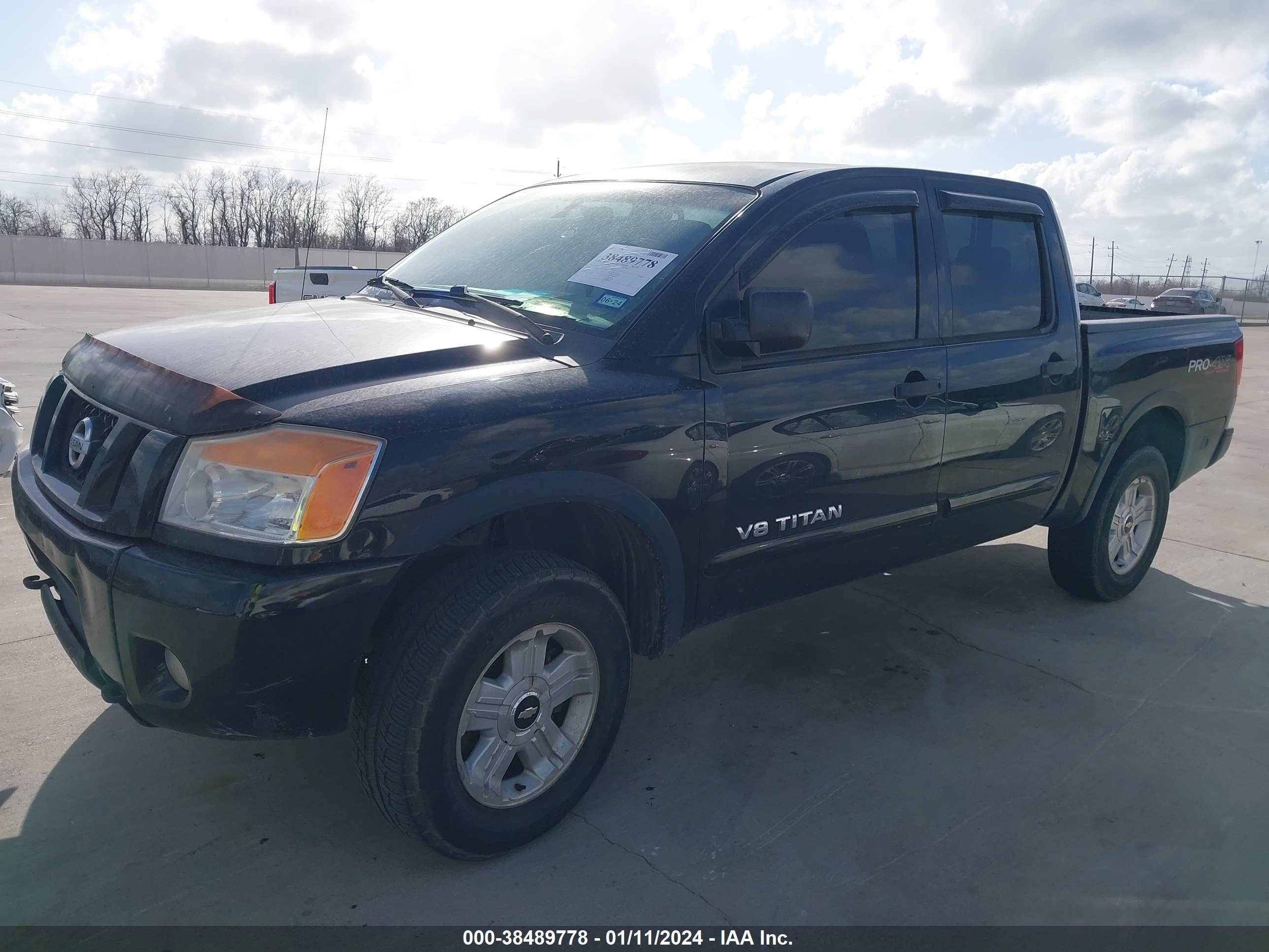 Photo 1 VIN: 1N6BA0ECXBN304965 - NISSAN TITAN 