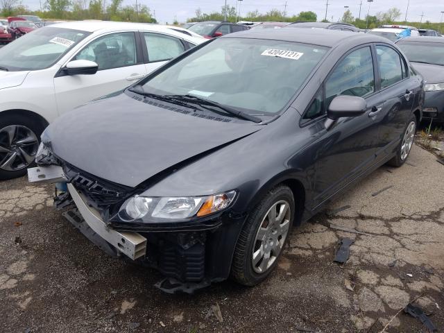 Photo 1 VIN: 2HGFA1F51AH565386 - HONDA CIVIC LX 