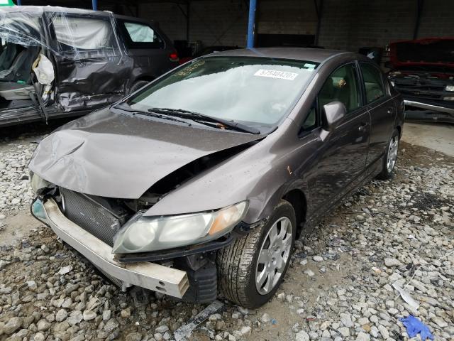 Photo 1 VIN: 2HGFA1F53AH560058 - HONDA CIVIC LX 