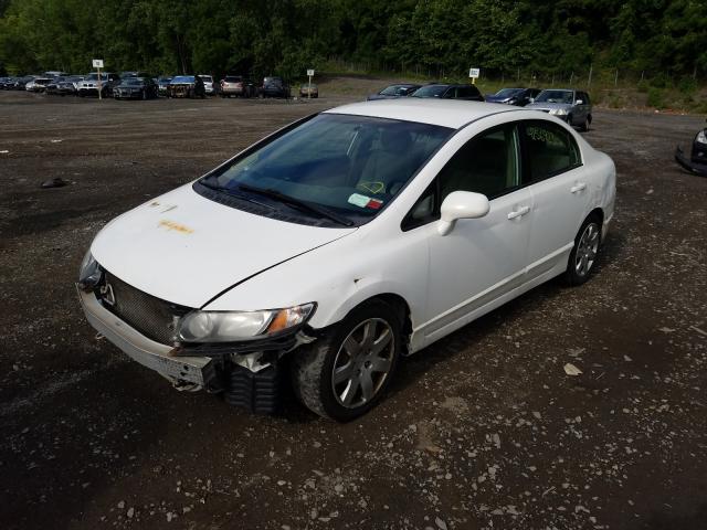 Photo 1 VIN: 2HGFA1F54AH581663 - HONDA CIVIC LX 