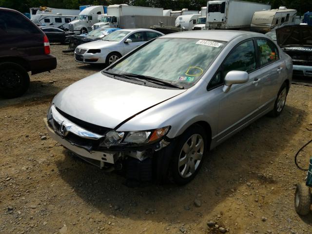 Photo 1 VIN: 2HGFA1F55AH321661 - HONDA CIVIC LX 