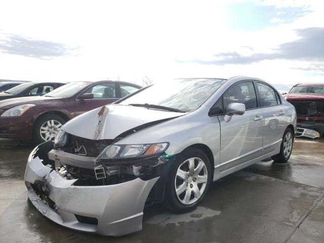 Photo 1 VIN: 2HGFA1F57AH328305 - HONDA CIVIC LX 