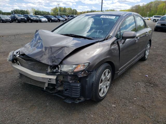 Photo 1 VIN: 2HGFA1F57AH576389 - HONDA CIVIC LX 